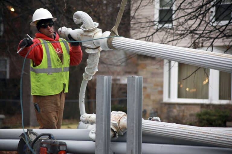 Sheldon-Cone-Jr-of-Clarkston-helps-place-an-old-street-light-on-a-truck-on-December-17-2014-in-the-Sherwood-Forest-neighborhood-in-Detroit